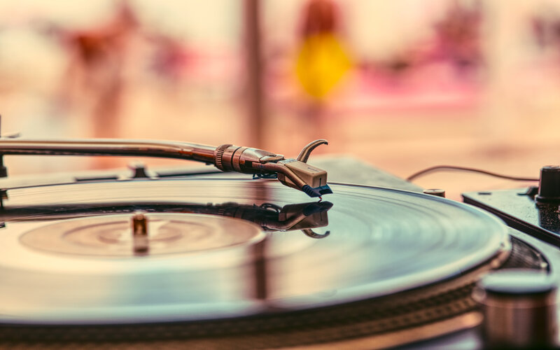 Turntable Playing Vinyl Record — Brown