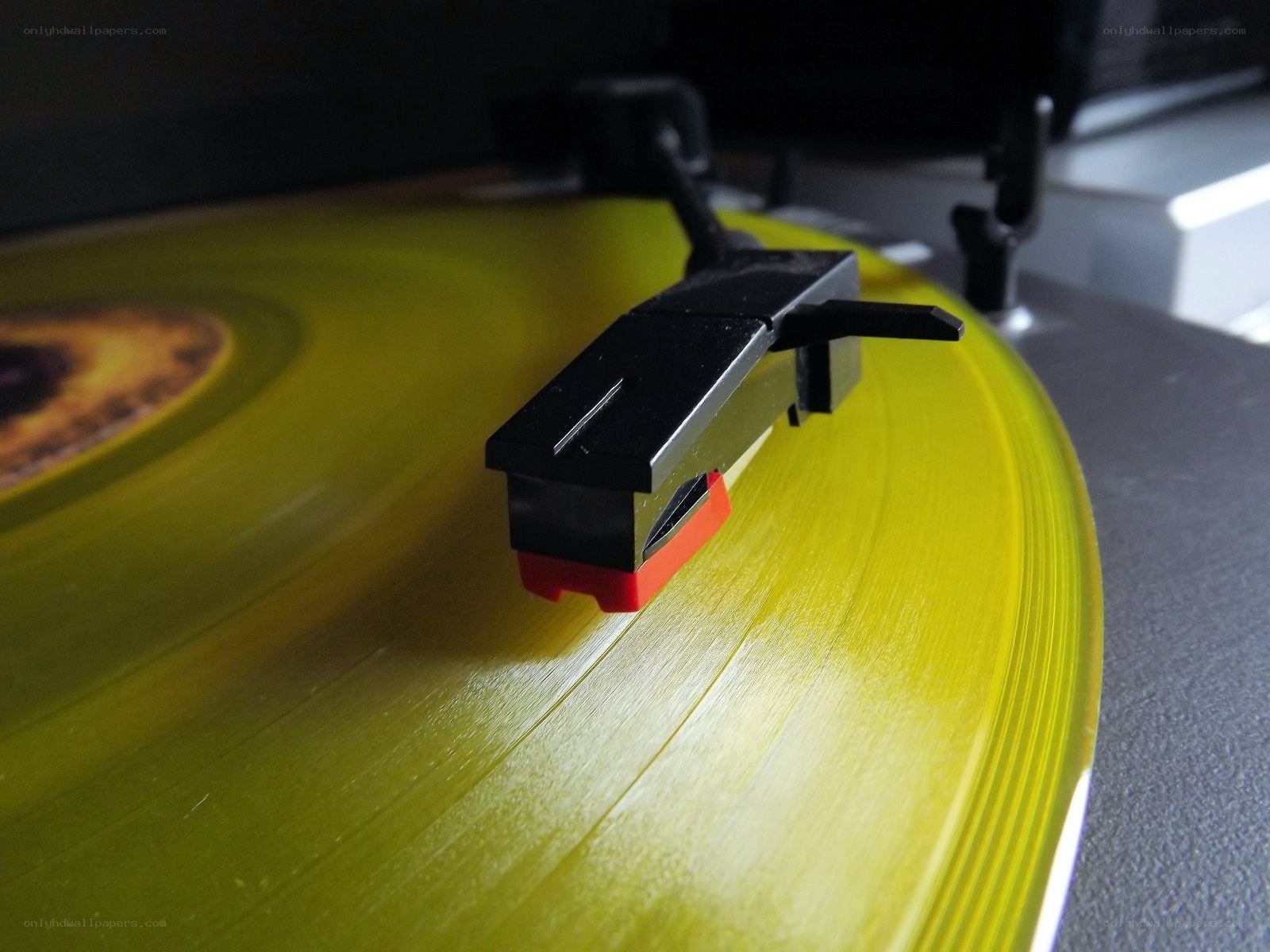 turntable playing yellow vinyl