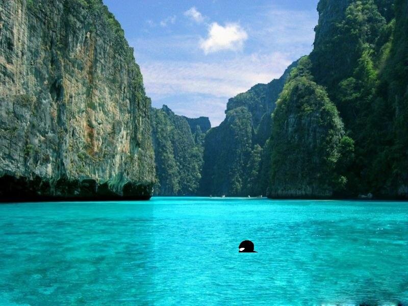 turquoise bay between cliffs