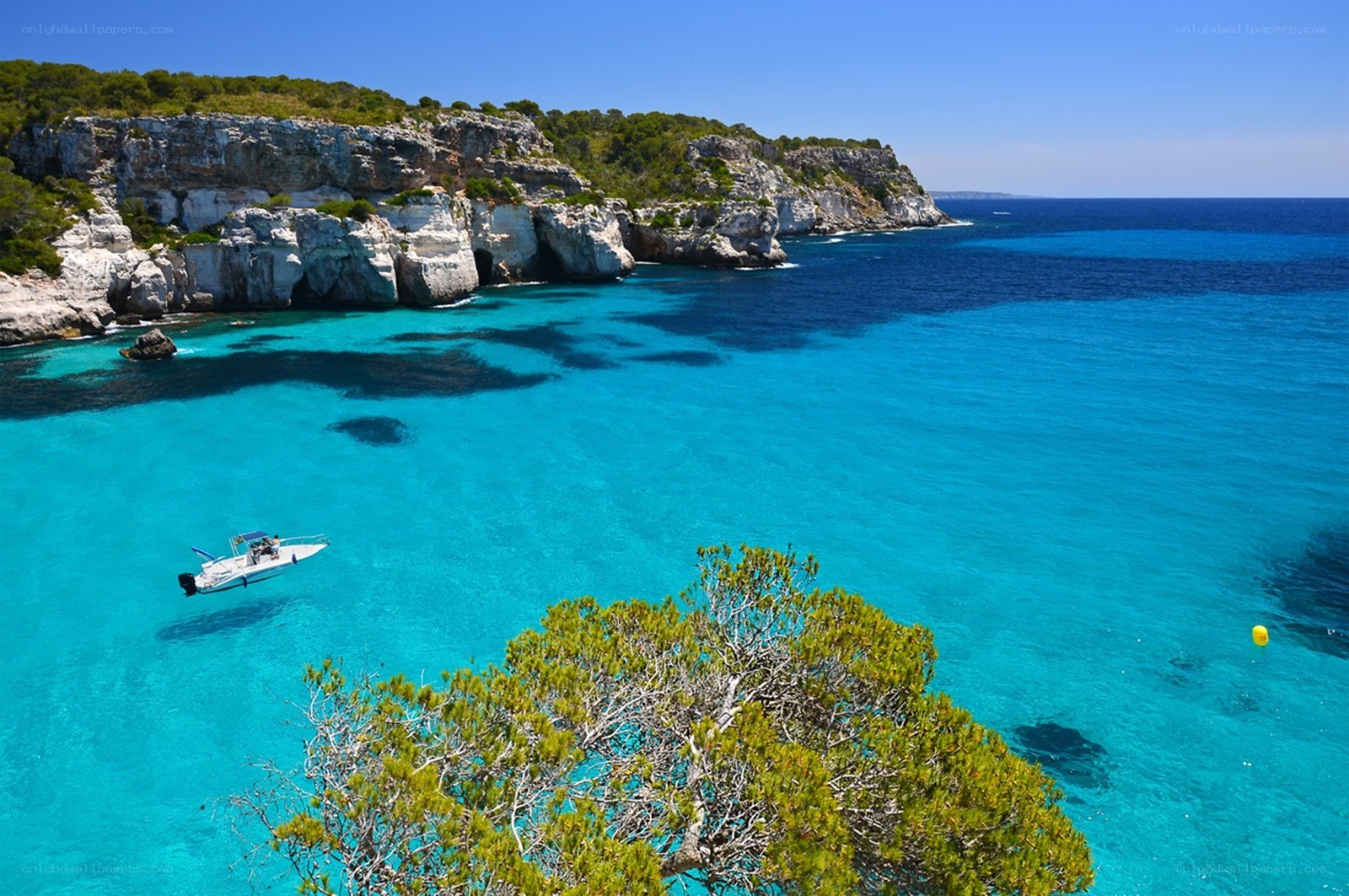 Turquoise cove with boat