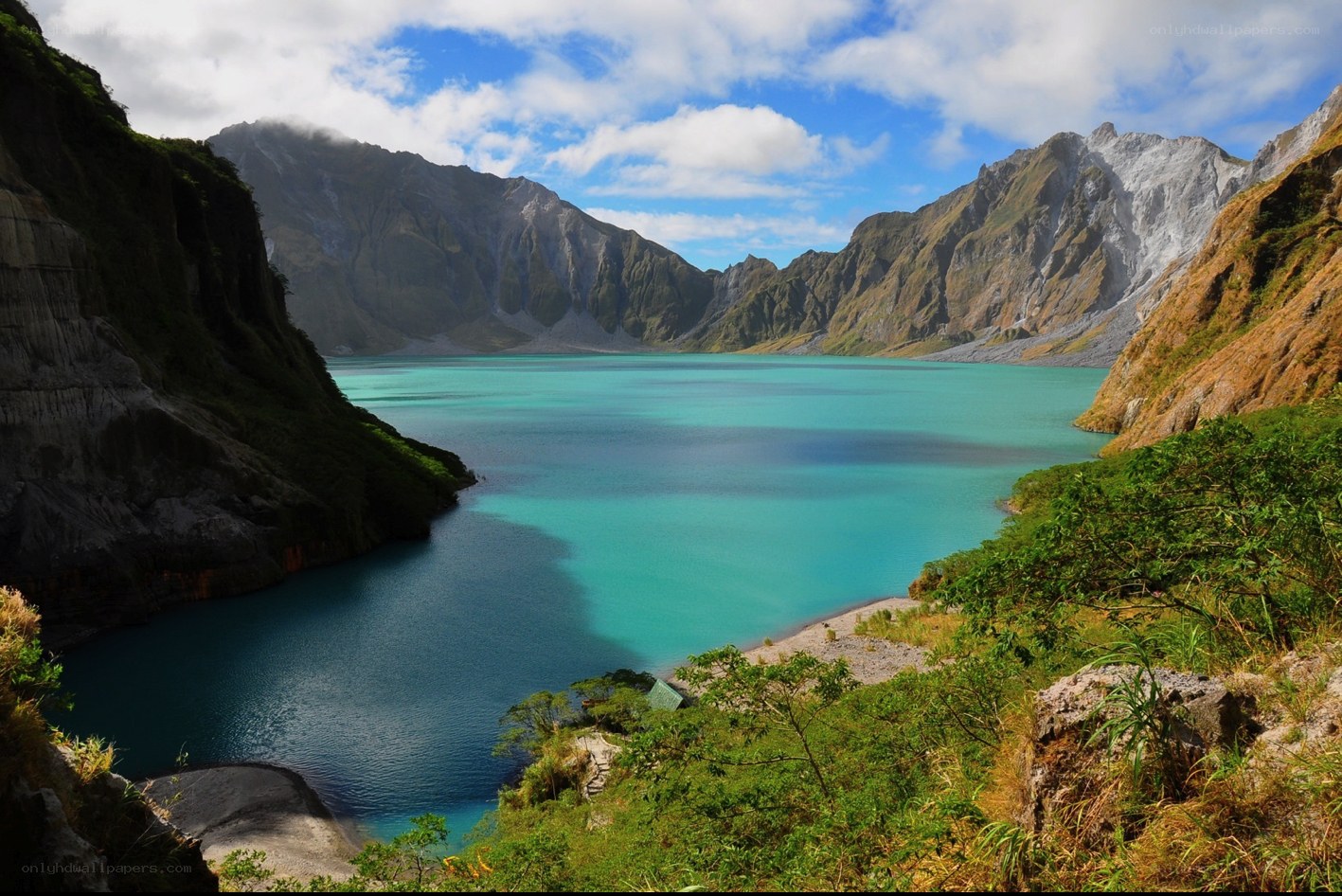 Turquoise crater lake in mountains