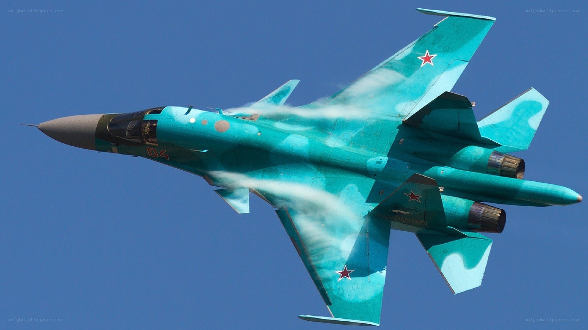 Turquoise fighter jet in flight
