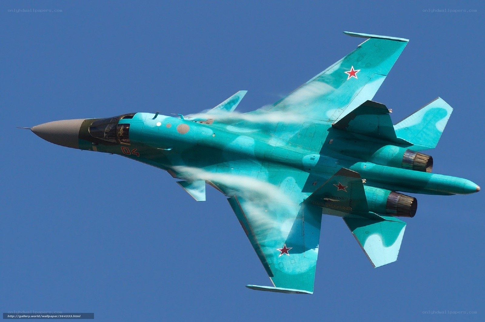 Turquoise fighter jet in flight