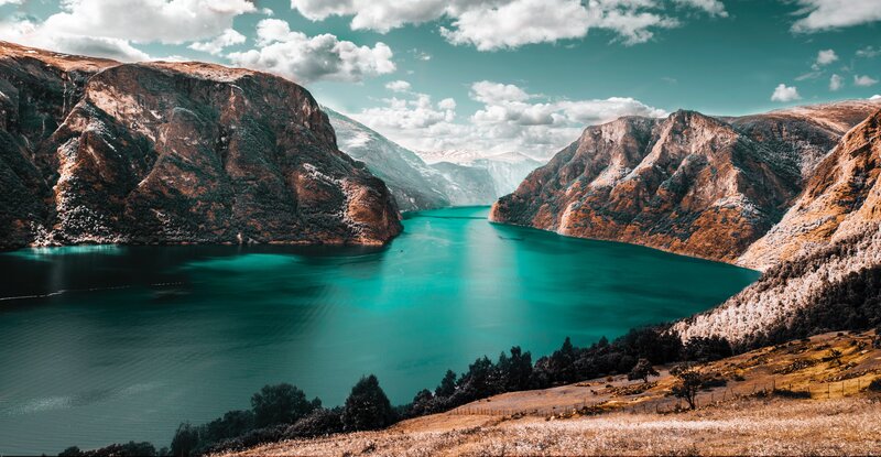 Turquoise Fjord Between Mountains