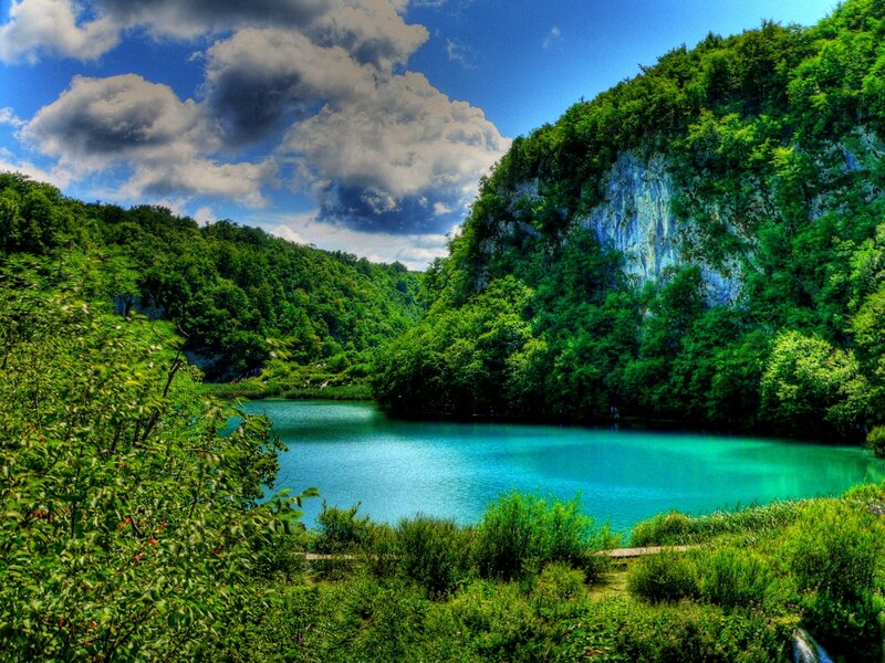 Turquoise lake in forested valley