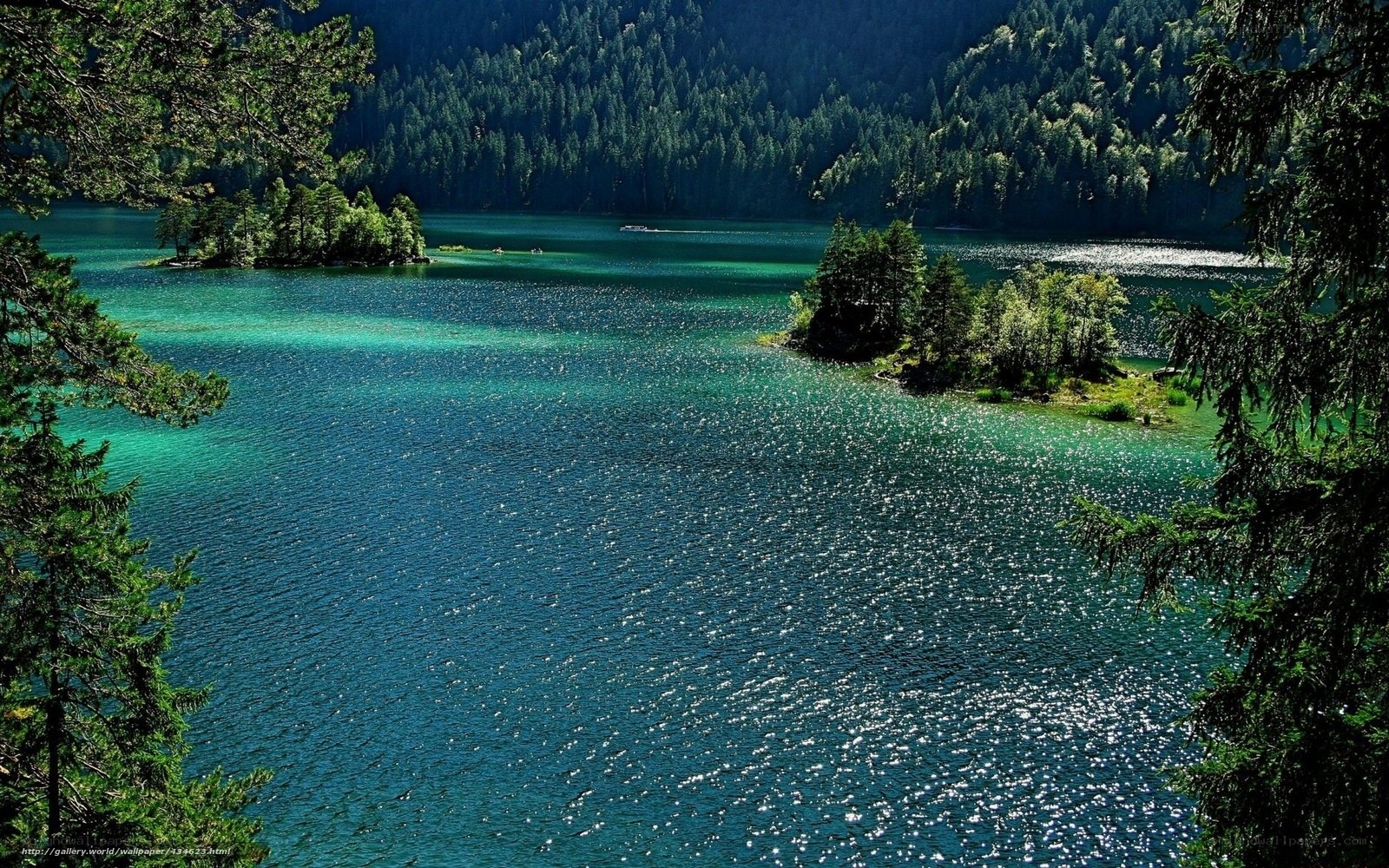 Turquoise lake with forested islands