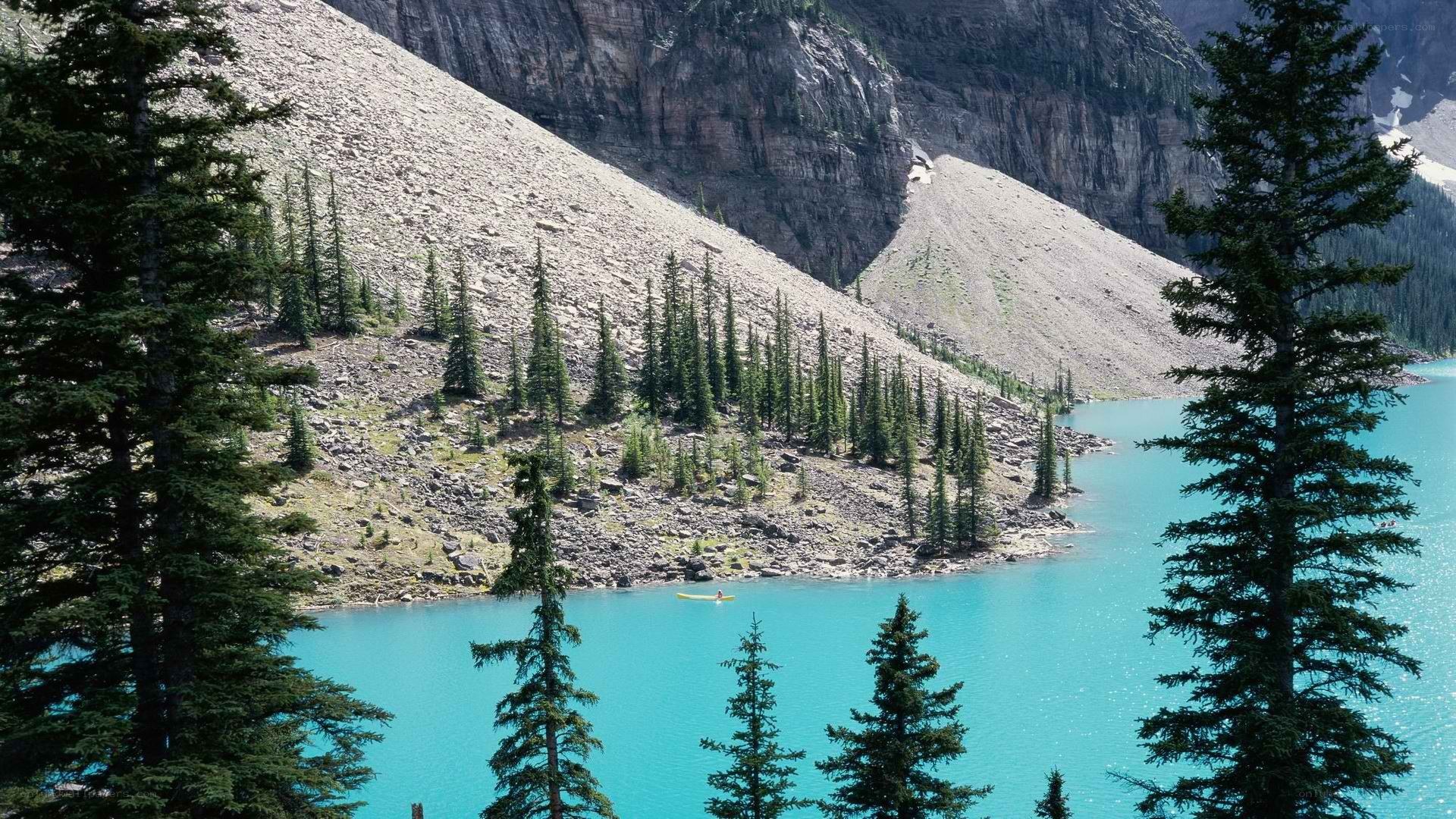 Turquoise lake with kayaker