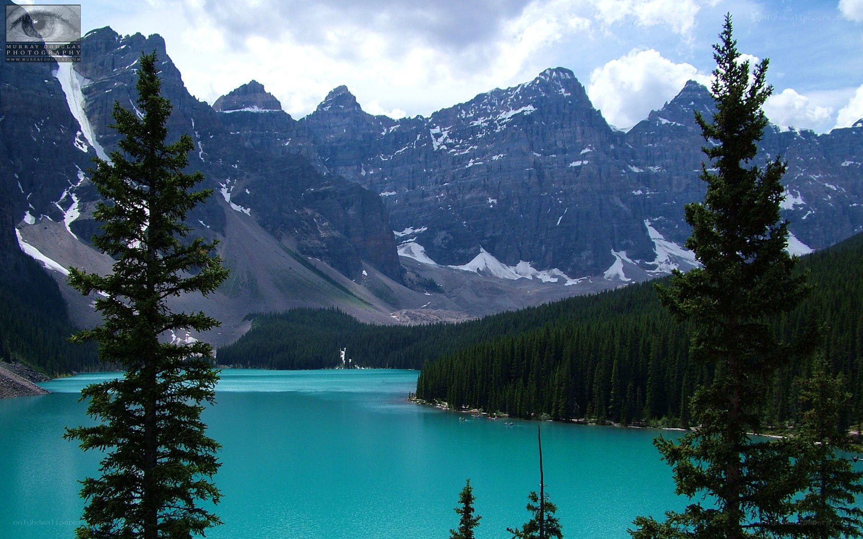 Turquoise lake with mountain backdrop