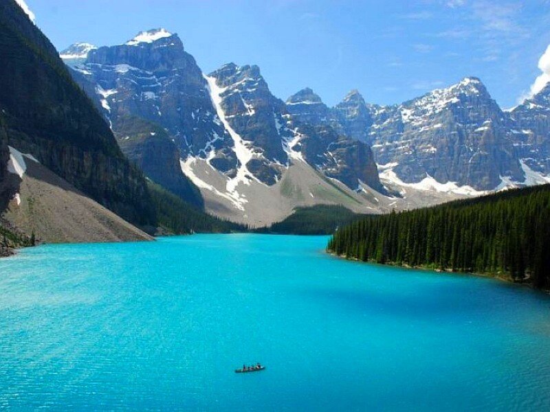 Turquoise lake with mountain backdrop
