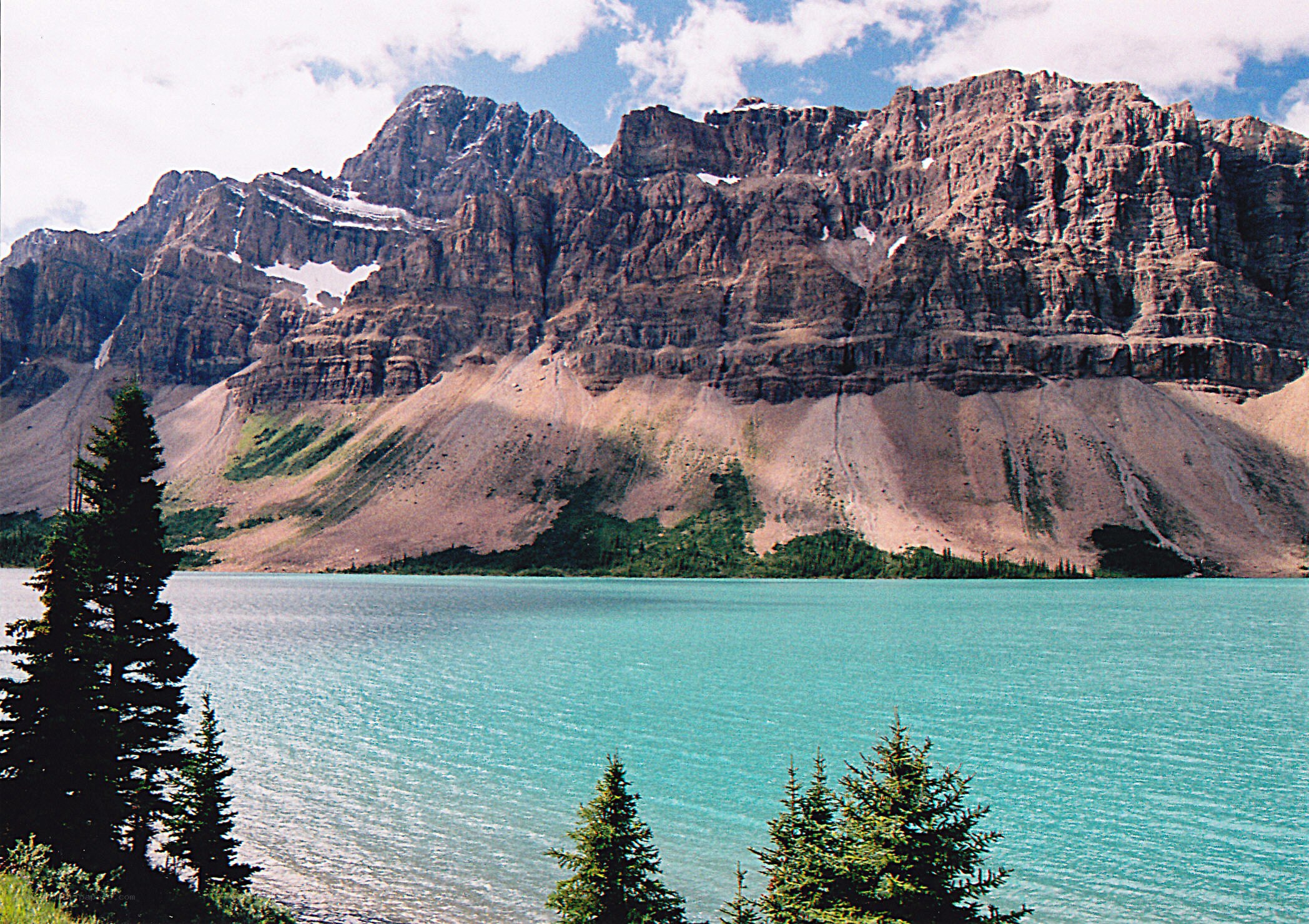 Turquoise lake with mountain backdrop