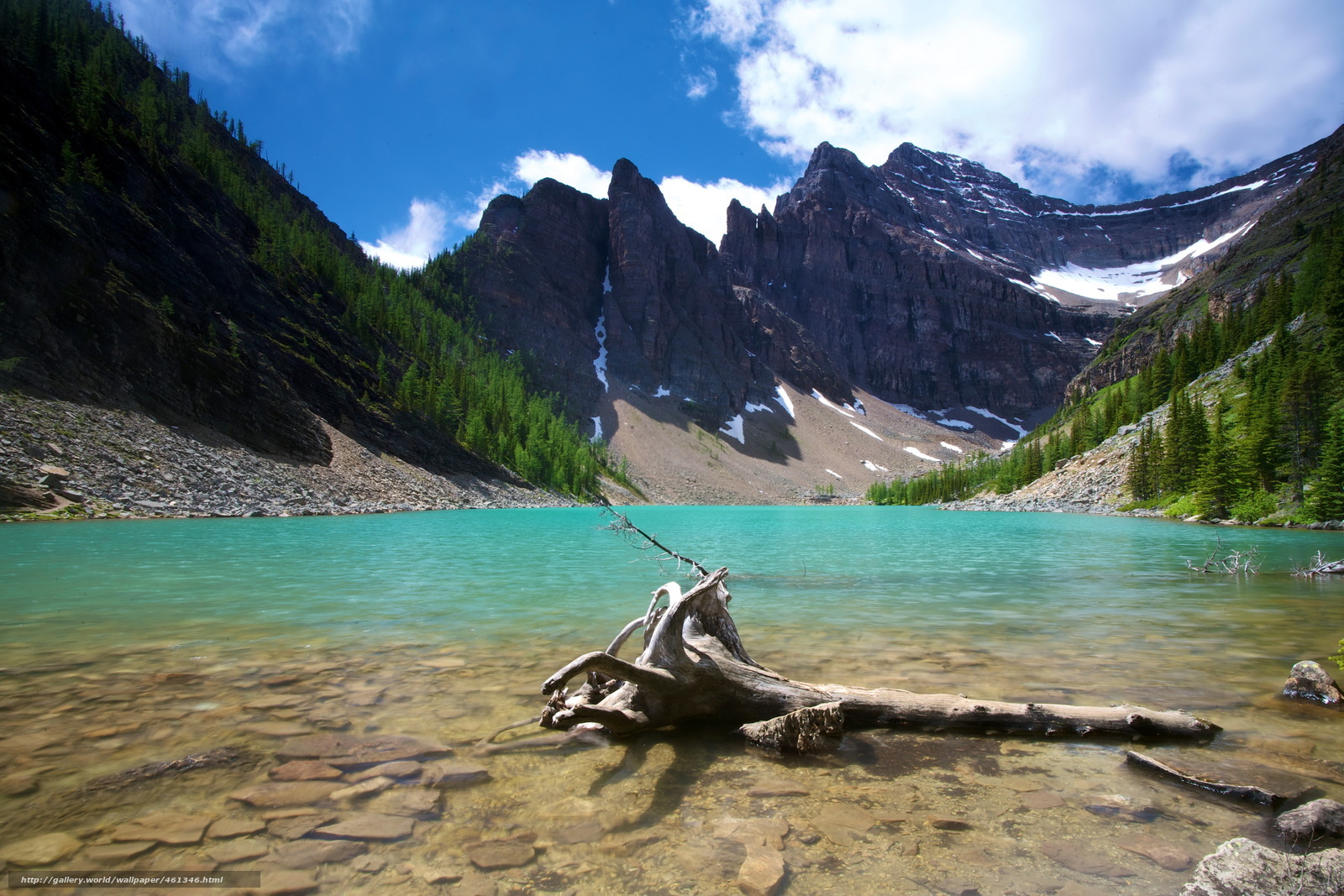 Turquoise lake with mountain backdrop