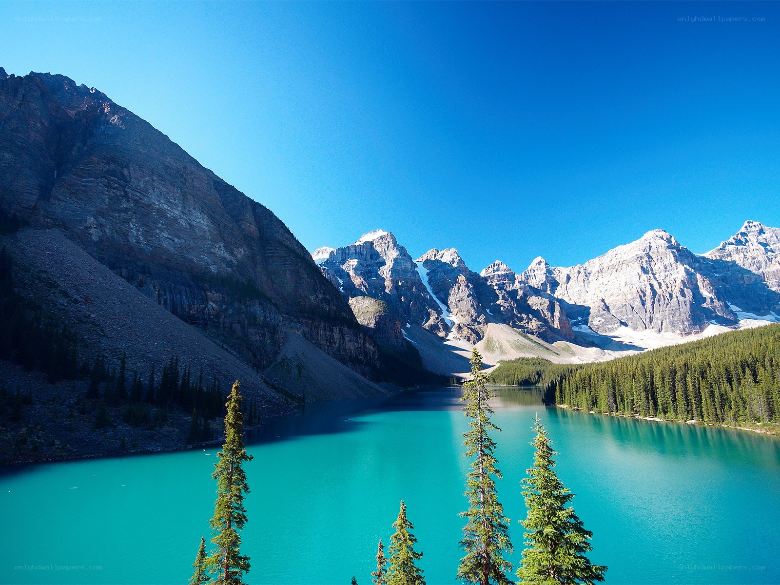 Turquoise lake with mountain peaks