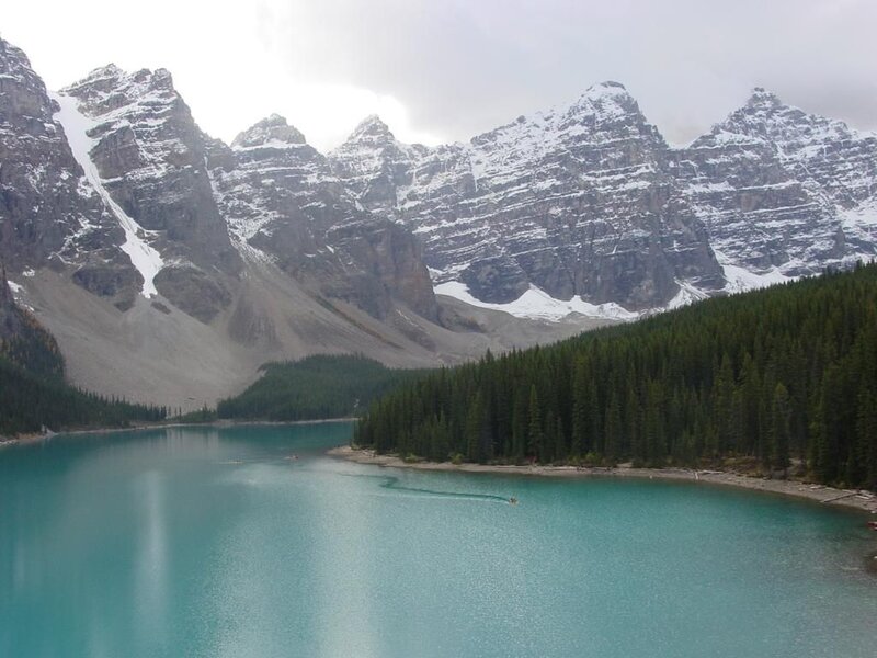 Turquoise lake with snow-capped mountains