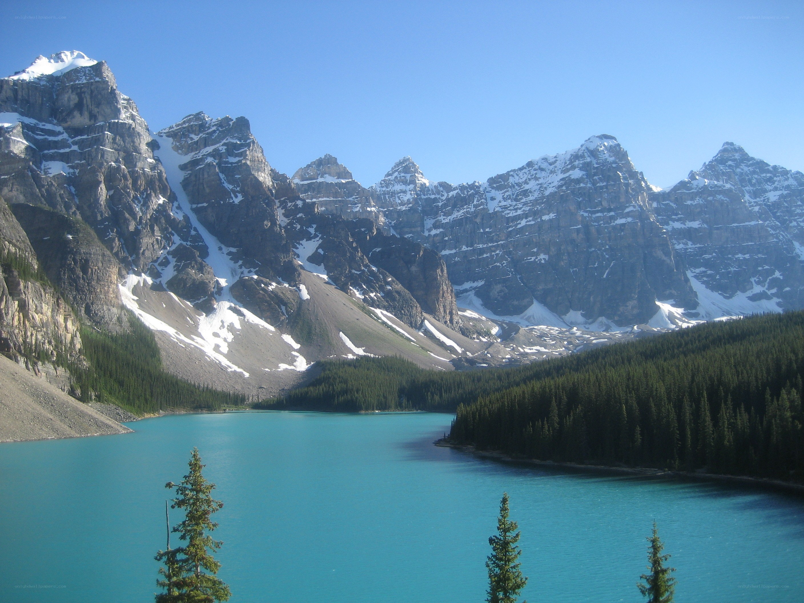 Turquoise lake with snow-capped mountains