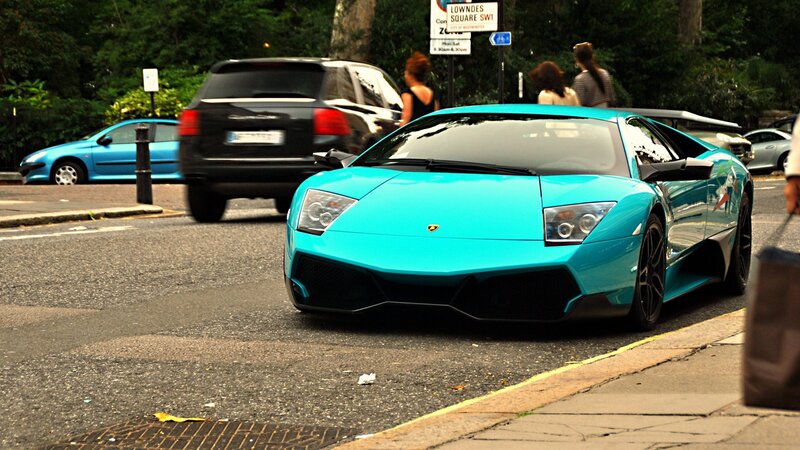 Turquoise Lamborghini on city street