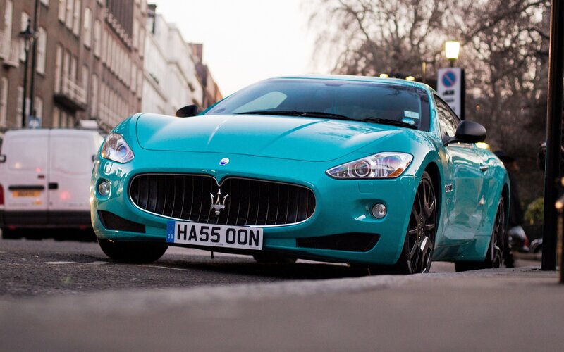 Turquoise Maserati on city street
