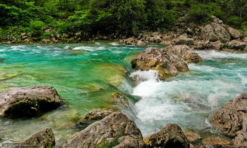 Turquoise river flowing through rocks