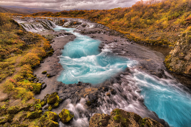 Turquoise river waterfall landscape