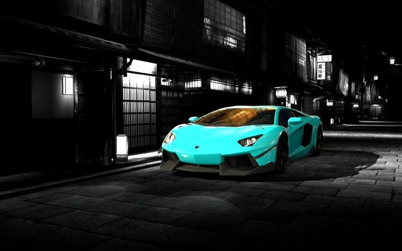 Turquoise sports car at night
