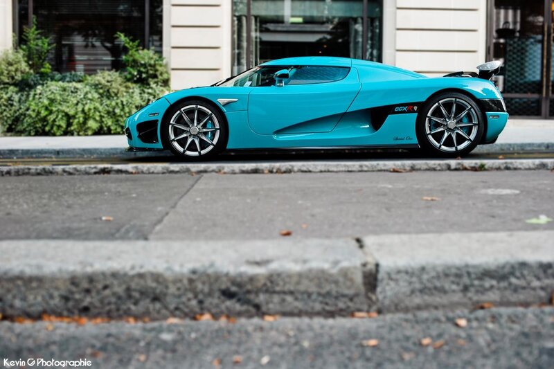 turquoise sports car on street