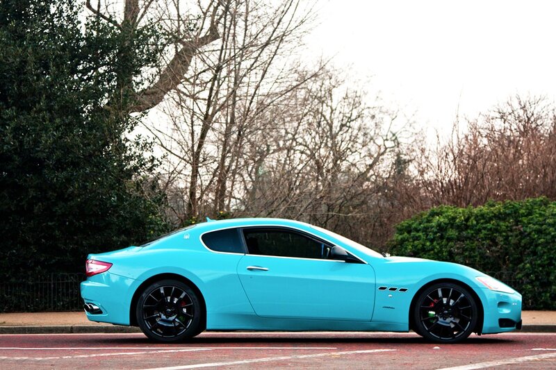 turquoise sports car on street