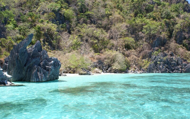 turquoise water and rocky shore