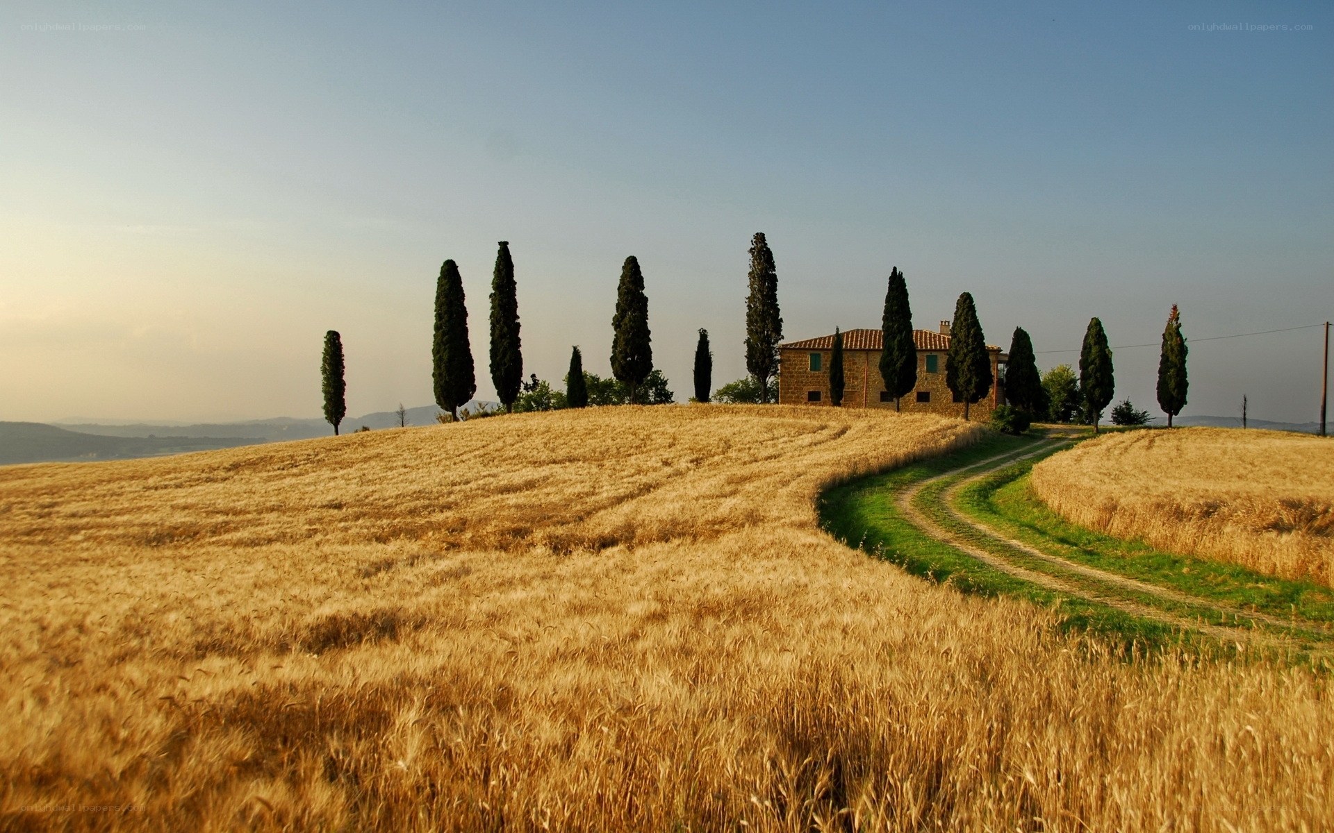 Tuscan countryside with farmhouse