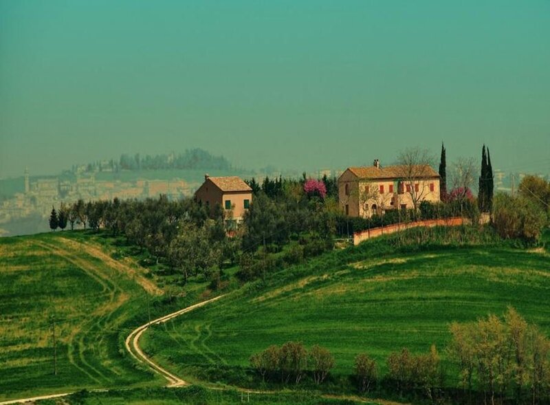Tuscan countryside with farmhouses