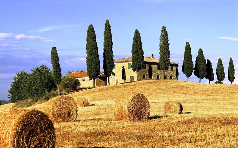 Tuscan countryside with hay bales