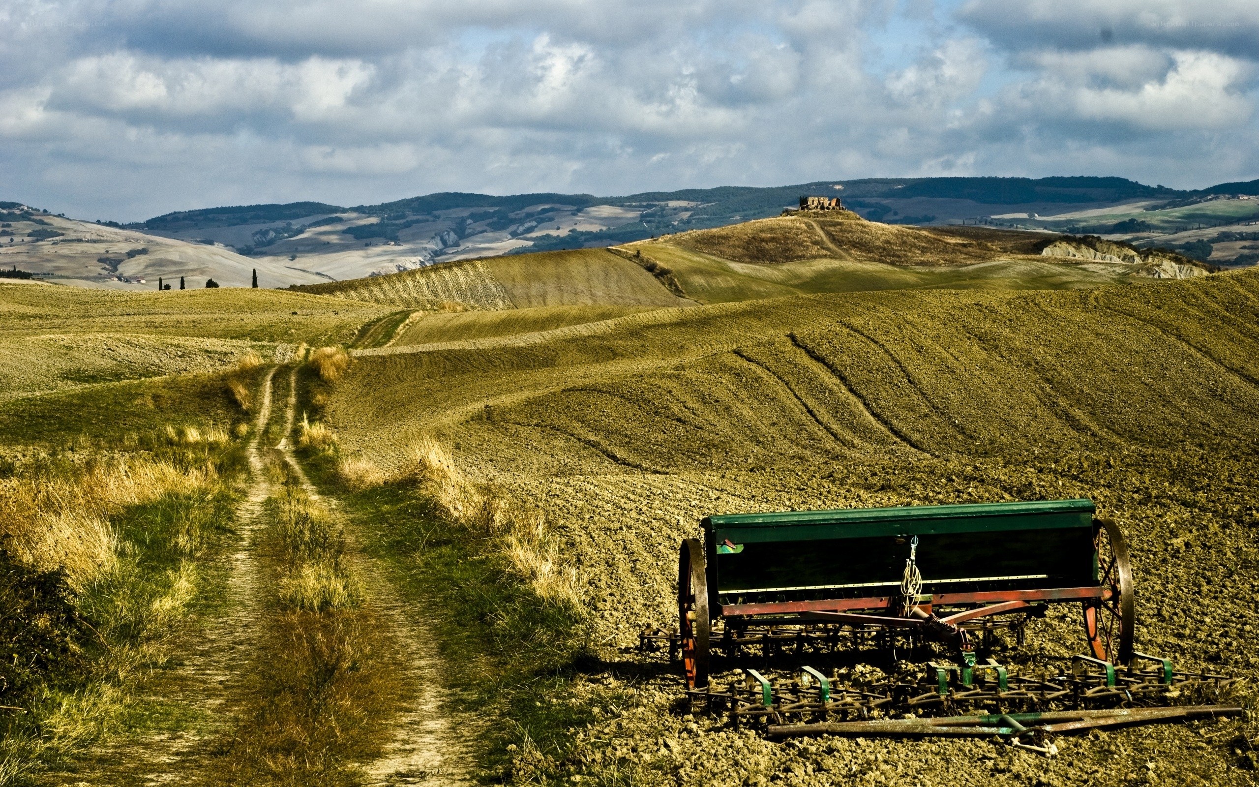 Tuscan farmland with plow