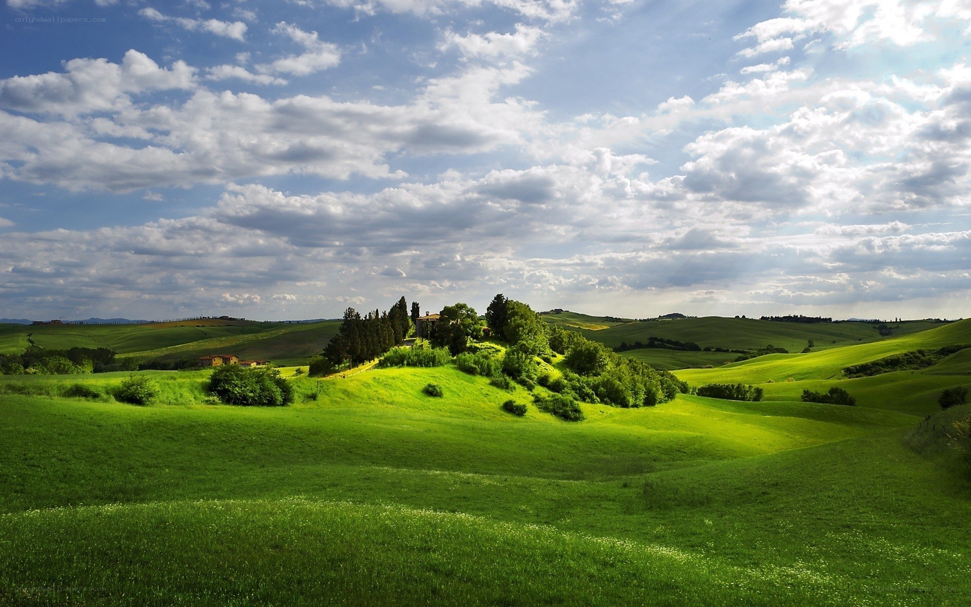 Tuscan hills under cloudy sky