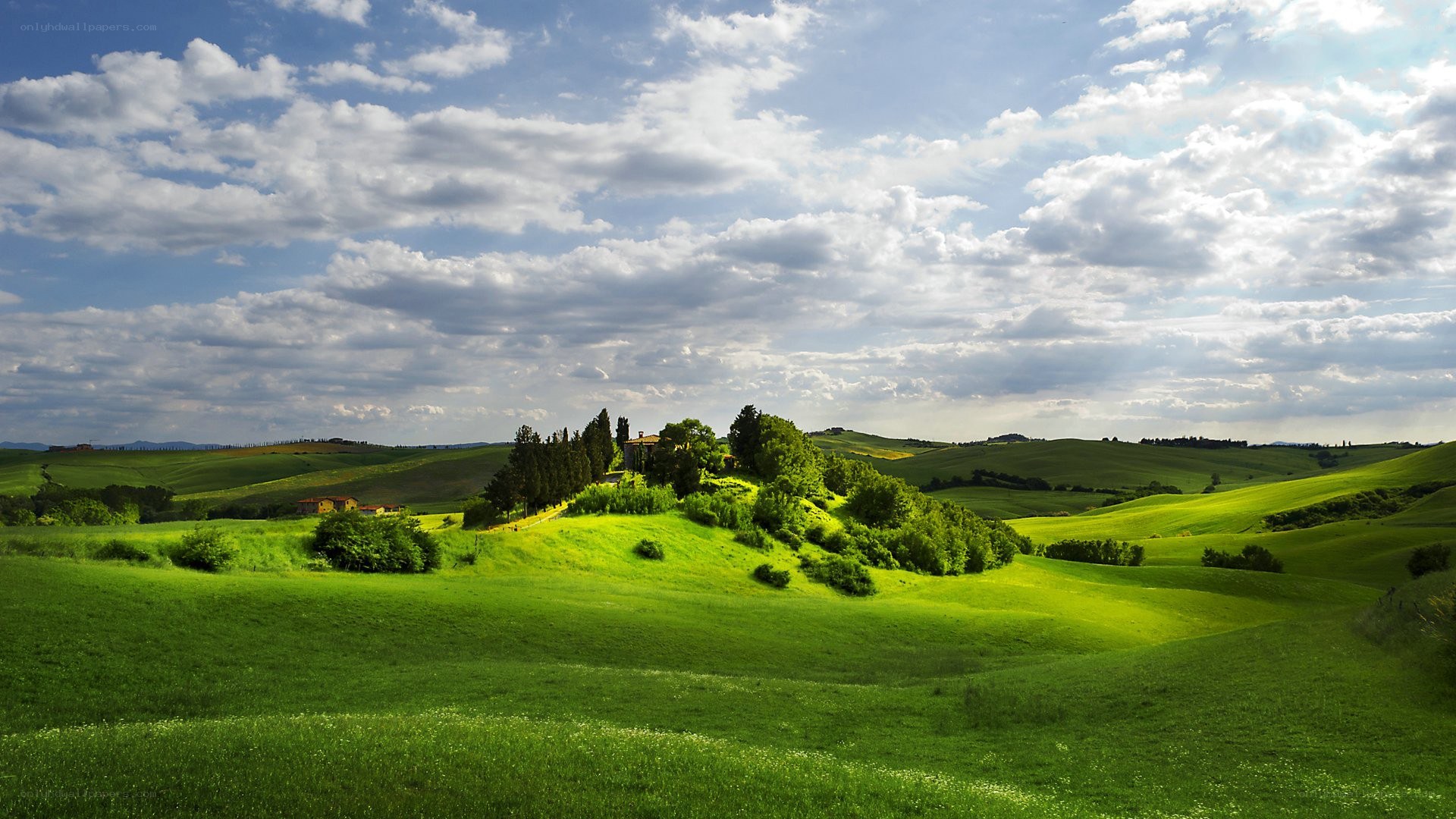 Tuscan hills under cloudy sky