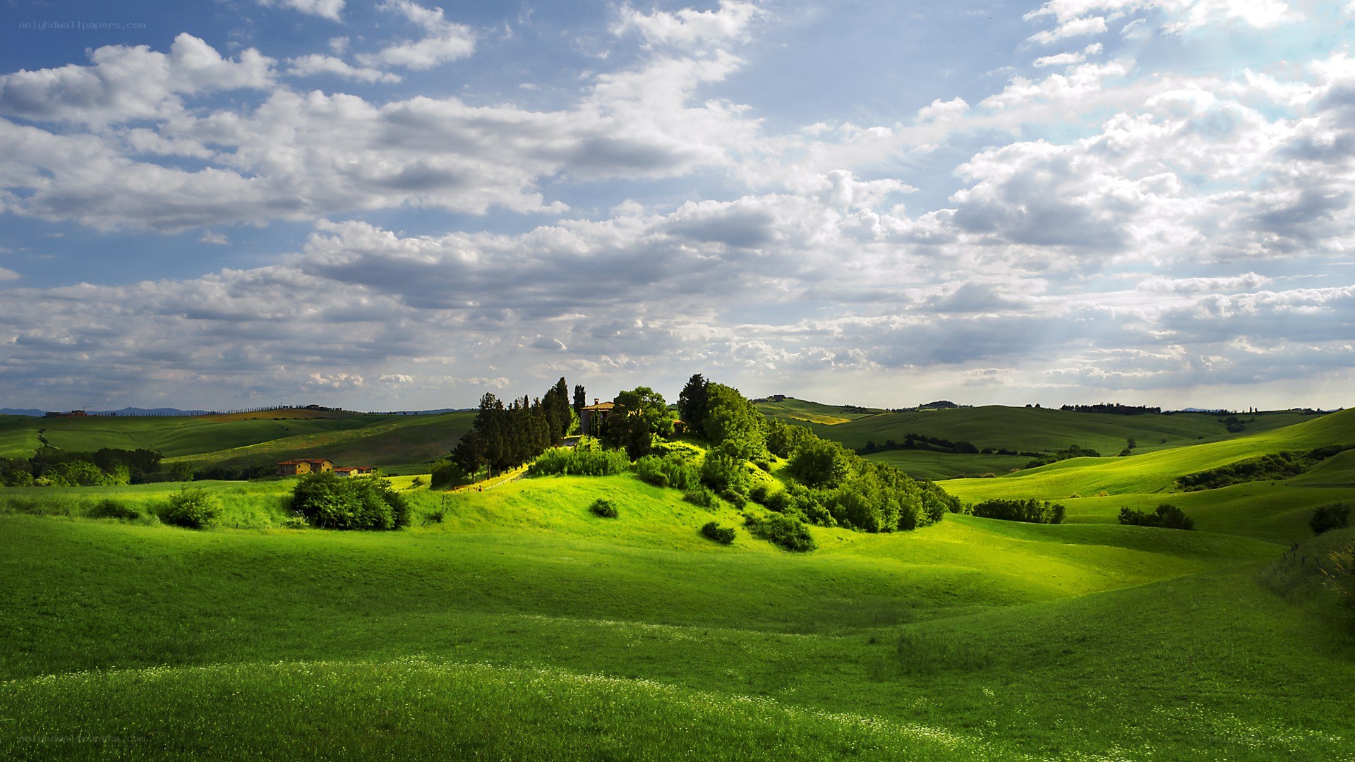 Tuscan hills under cloudy sky