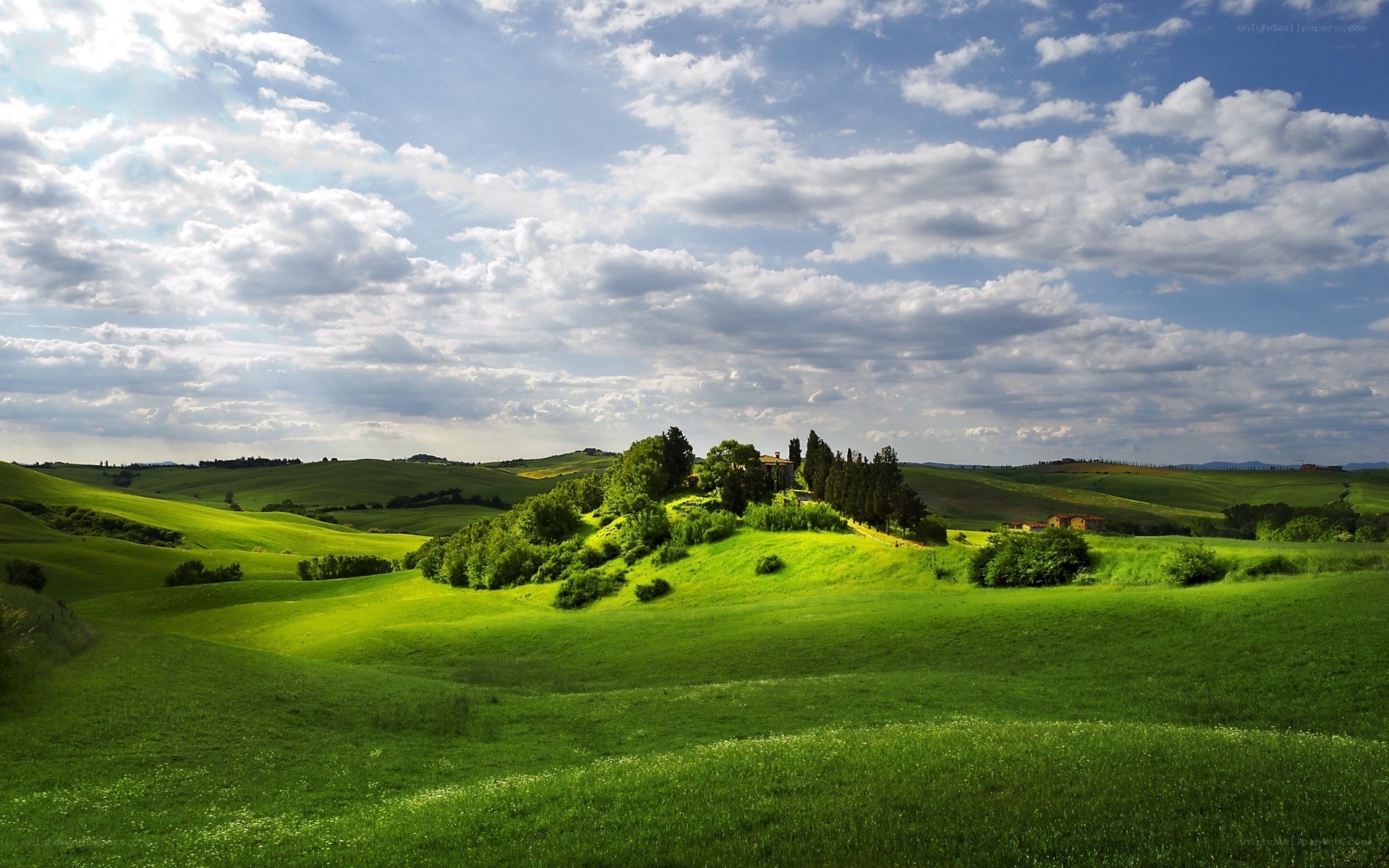 Tuscan hills under cloudy sky