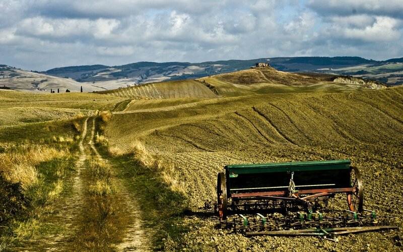 Tuscan hills with farm equipment