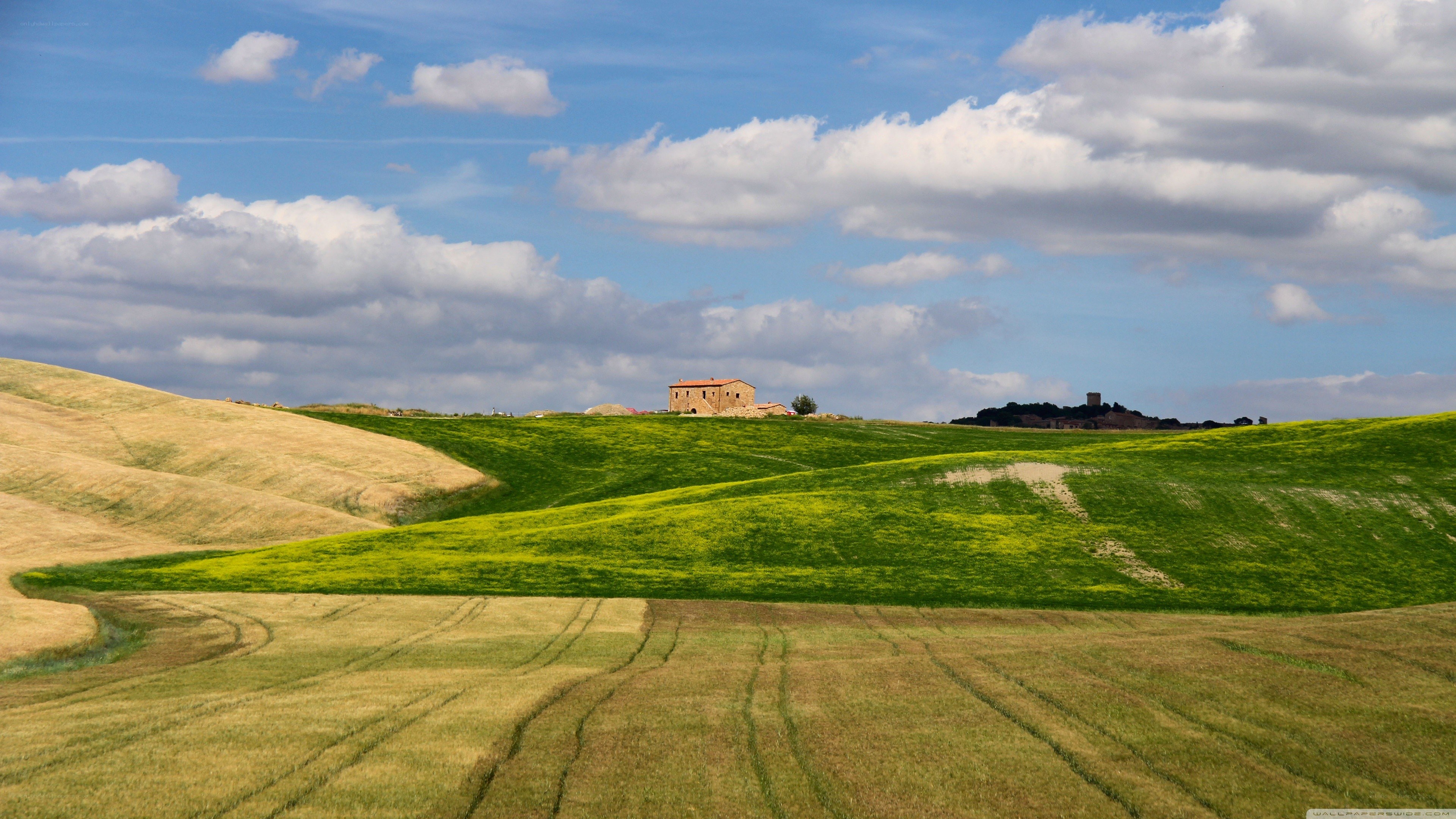 Tuscan hills with farmhouse