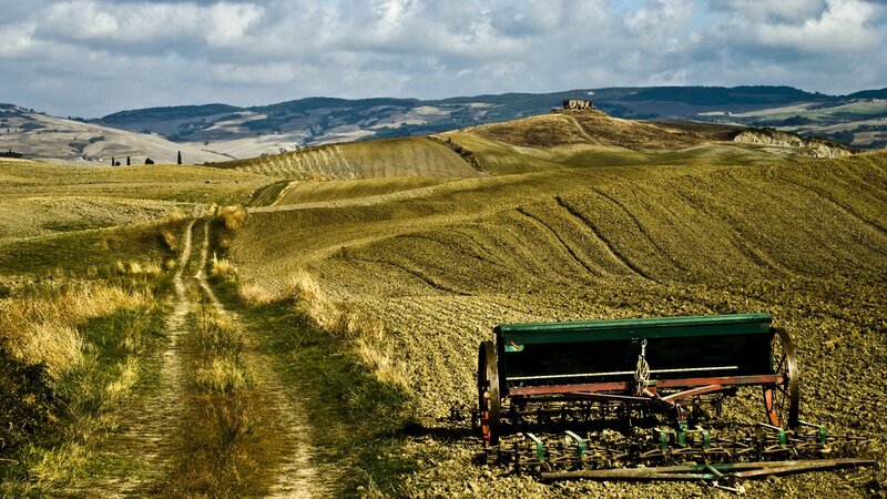 Tuscan landscape with farm equipment