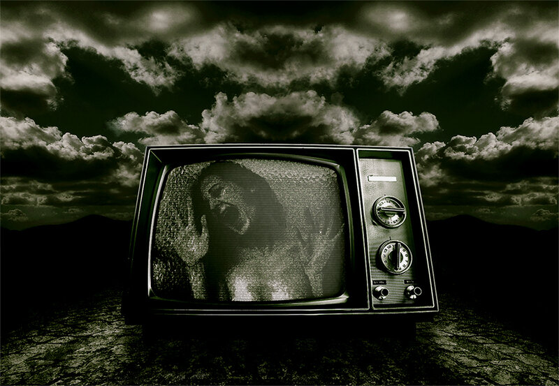 TV with screaming face in desert