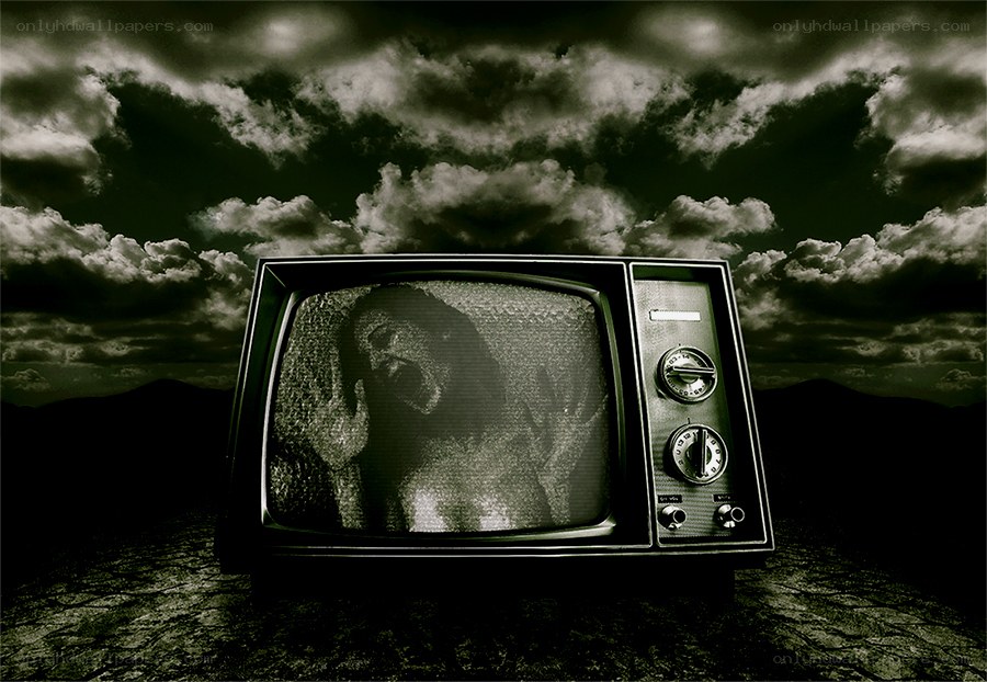 TV with screaming face in desert