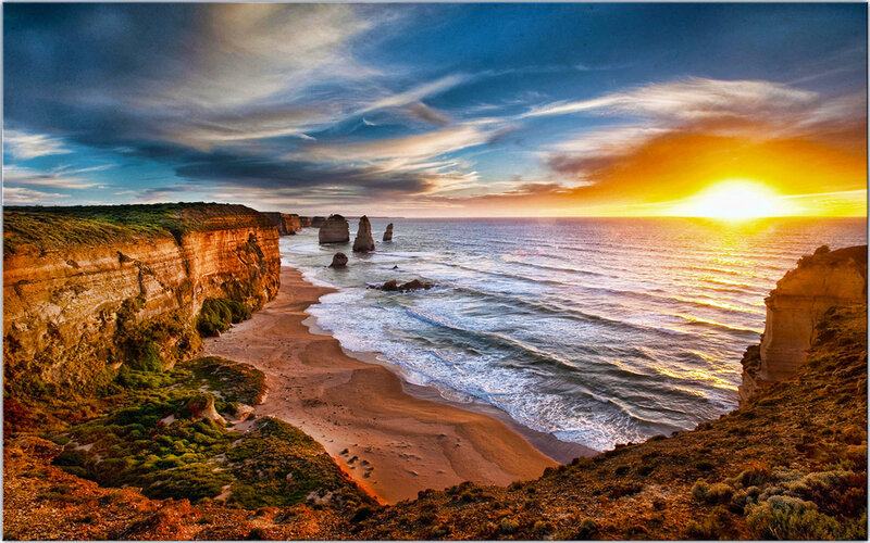 Twelve Apostles Rock Formations — Blue, Dramatic, Sunset, Photograph, Cliffs, Ocean, Beach, Sun