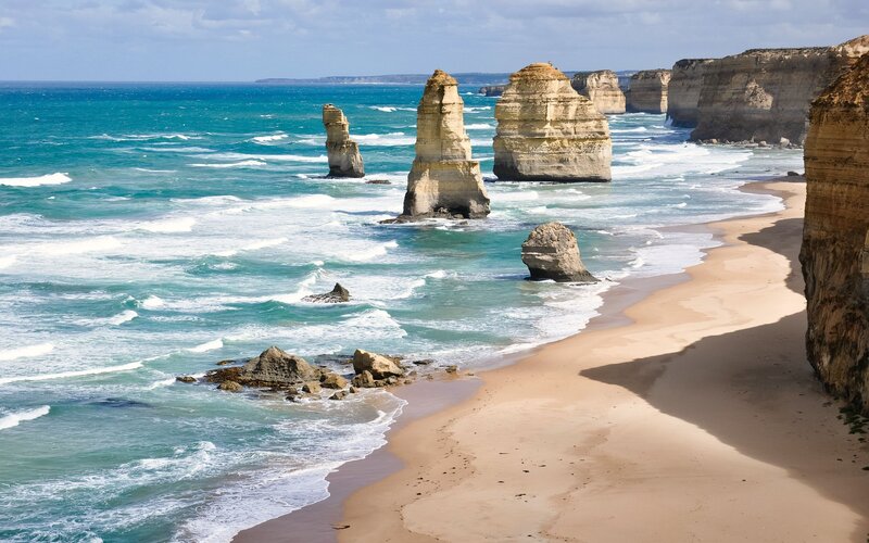 Twelve Apostles Rock Formations — Blue, Serene, Afternoon, Photograph, Ocean, Beach