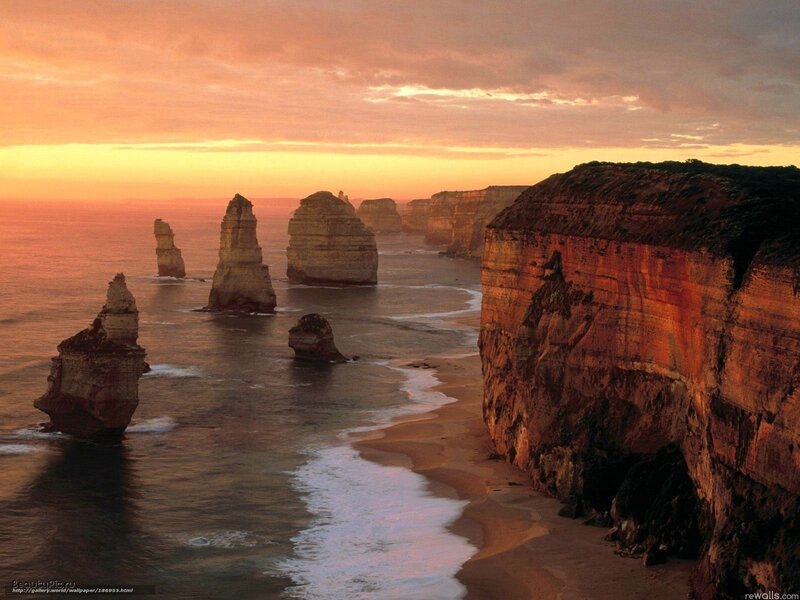 Twelve Apostles Rock Formations — Orange, Dramatic, Sunset, Photograph, Ocean, Cliffs