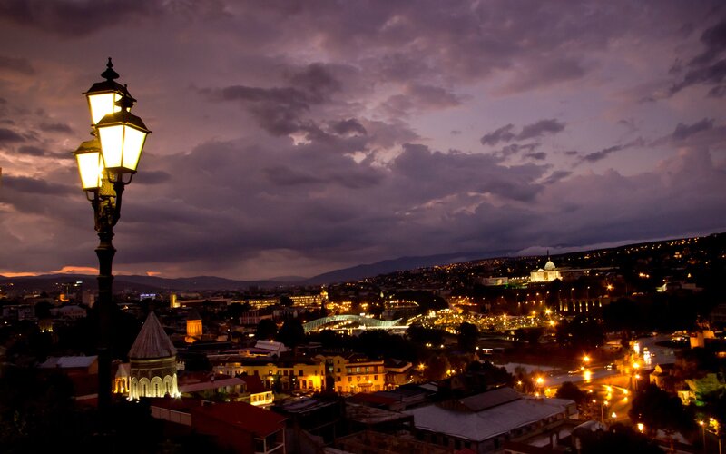Twilight cityscape with lamppost