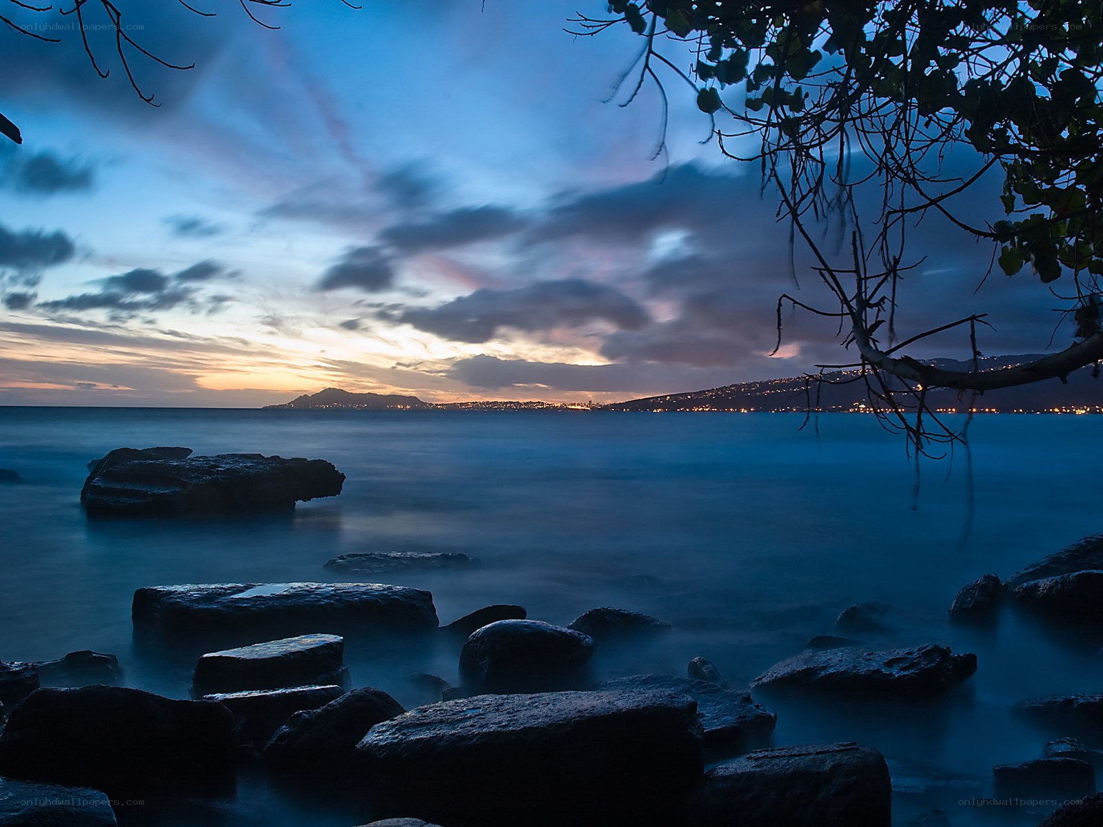 Twilight coast with city lights