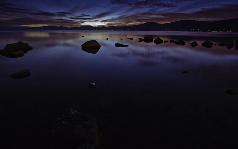 Twilight lake with rocks