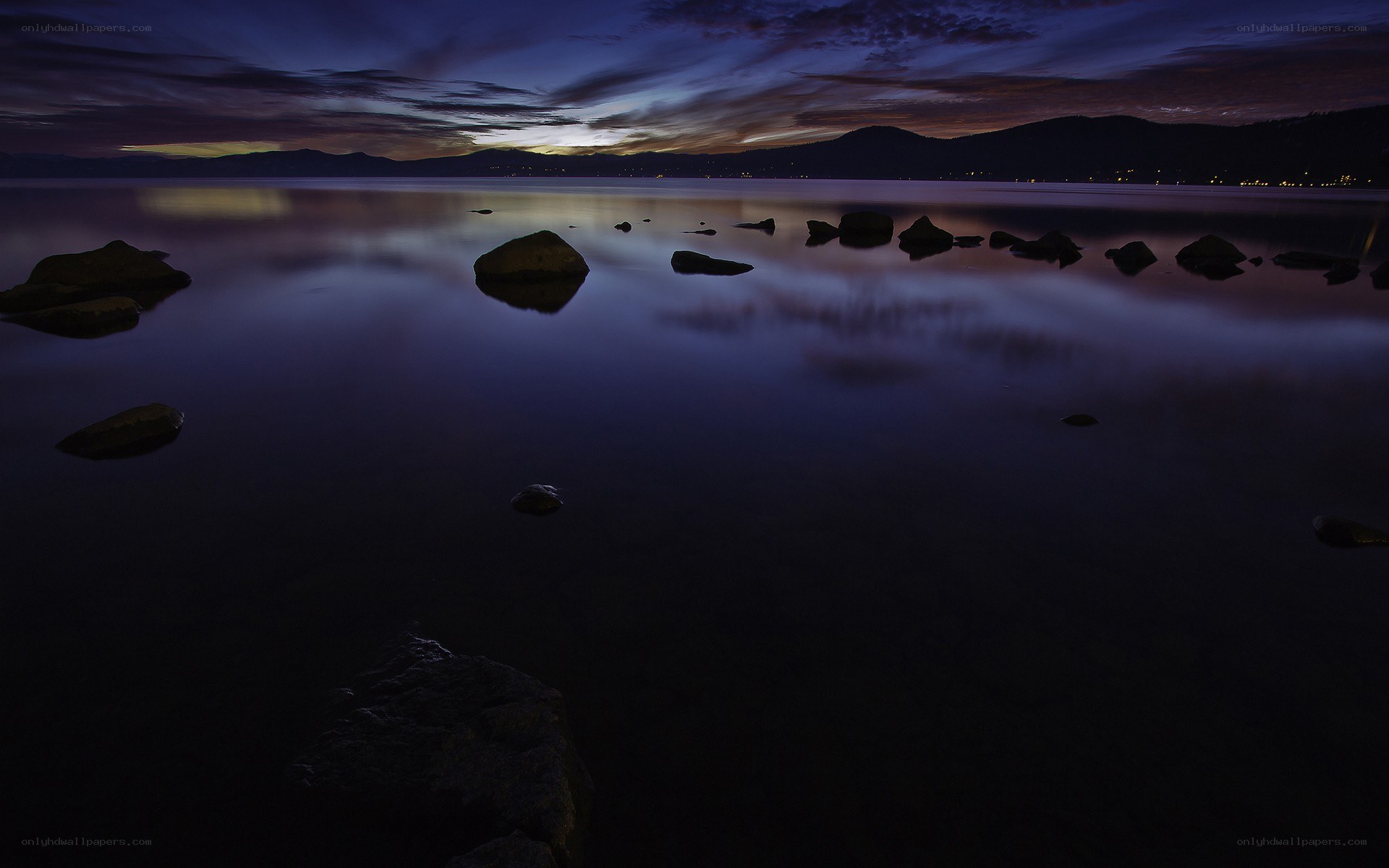 Twilight lake with rocks