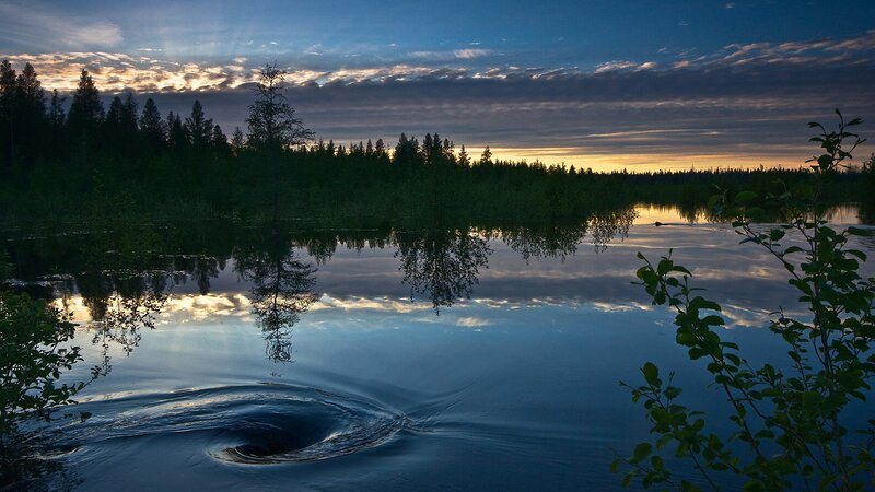 Twilight lake with swirling water