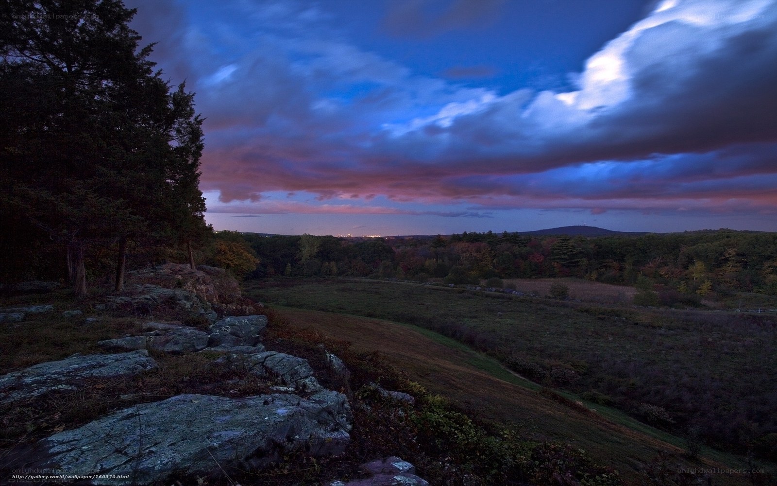Twilight over a rocky hillside