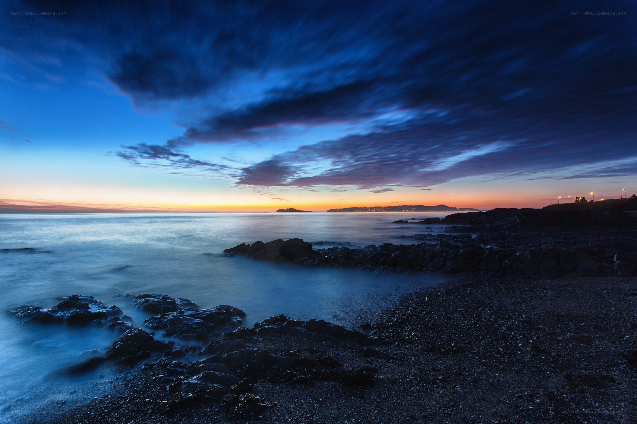 Twilight over rocky coastline