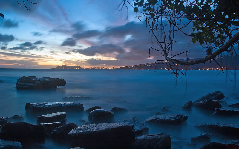 Twilight over rocky shoreline